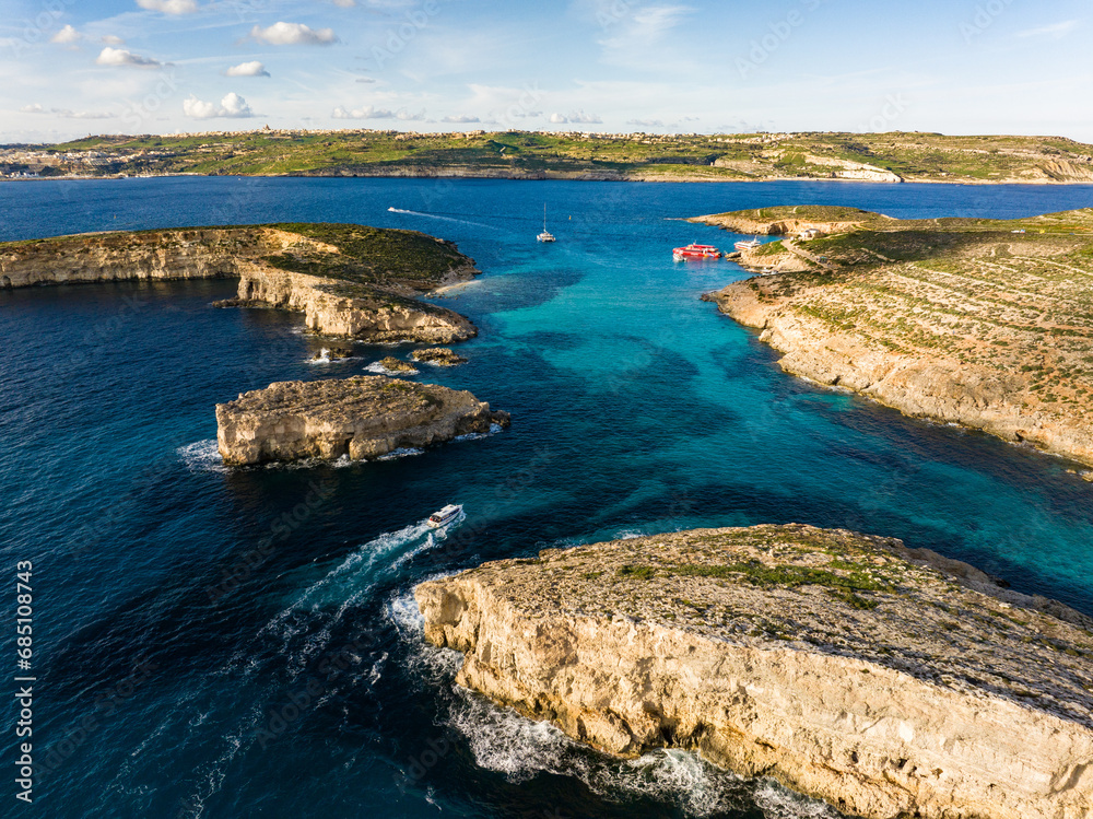 Azure paradise of Blue Lagoon in Malta aerial photo. A breathtaking tapestry of turquoise waters and rocky allure.