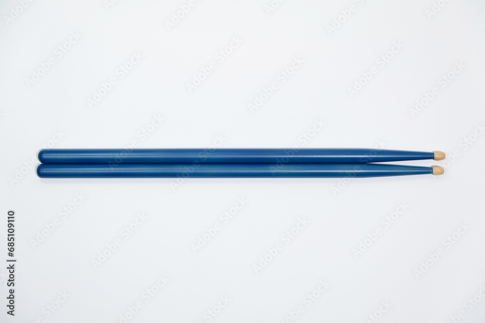 Colored Blue Drumsticks on a white background Colored Blue Drumsticks on a white background
