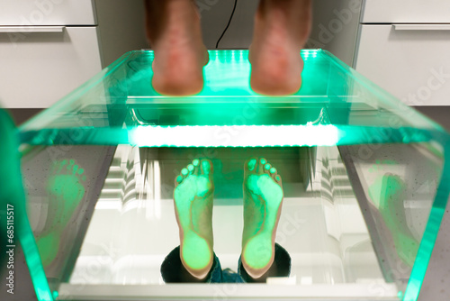 Orthopedic insole. The orthopedist works with the patient. Orthopedic clinic. Choice of insoles in an orthopedic clinic. The orthopedist offers the insole to the patient Foot care