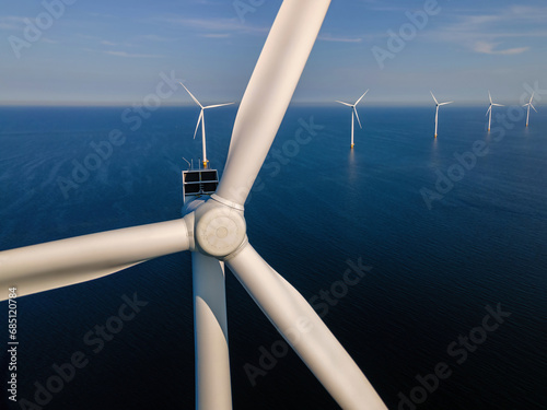 Wind turbine from an aerial view, Drone view at wind park Westermeerdijk a windmill farm in the lake IJsselmeer the biggest in the Netherlands,