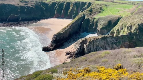 Looking down into Skrinkle Haven Beach near Lydstep Tenby Pembrokeshire Wales photo