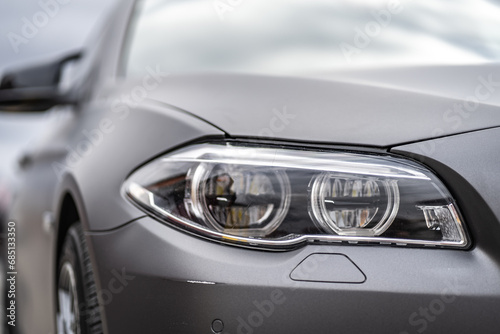 headlight front of modern prestigious car closeup © Iryna