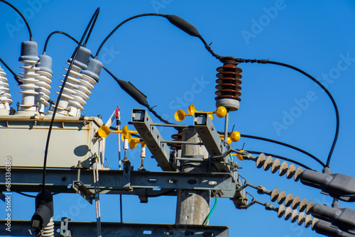 close up of electric power transmission line during the day. High voltage switchgear and power generation equipment.