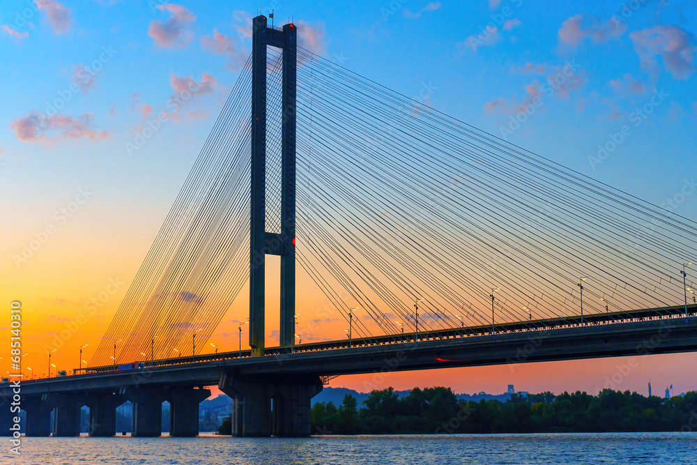 Fototapeta premium Dnipro Sunset Glow: Southern Bridge