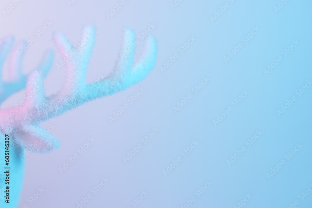 White reindeer antle in vibrant bold gradient holographic colors. Christmas and New Year minimal art concept. White reindeer antle in vibrant bold gradient holographic colors. Christmas and New Year minimal art concept.