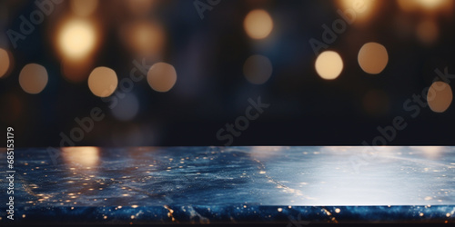 Holiday Illumination and Decoration Concept - Christmas Garland Bokeh Lights Over Dark Blue Background and Gold Marble Table.