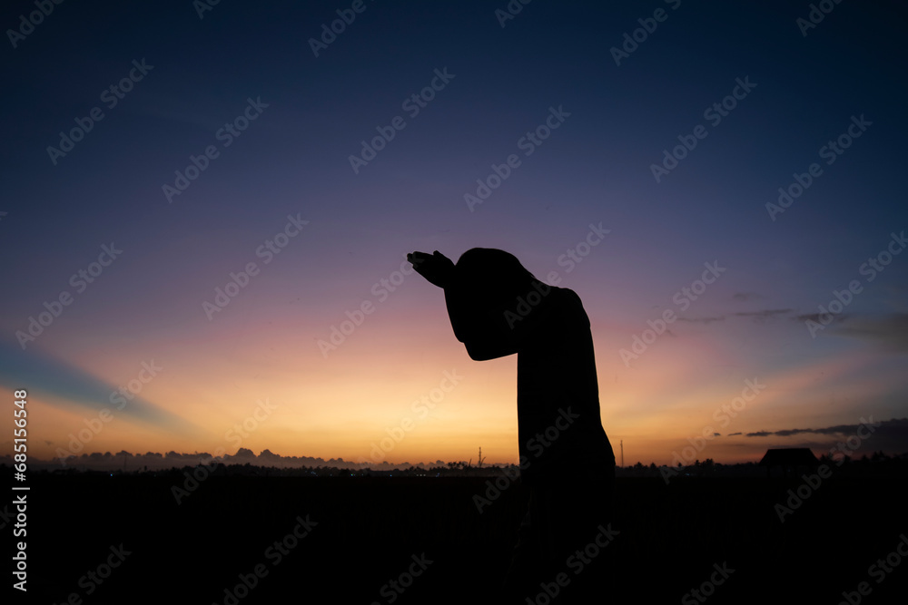 Silhouette photo at sunset with a beautiful sky background