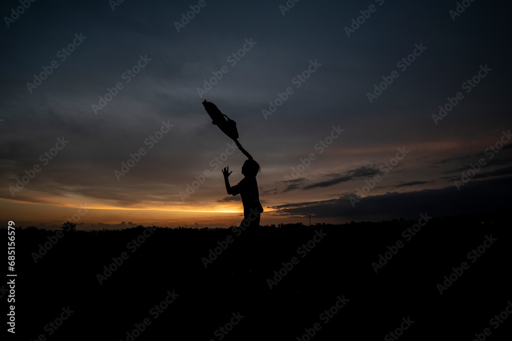 Silhouette photo at sunset with a beautiful sky background