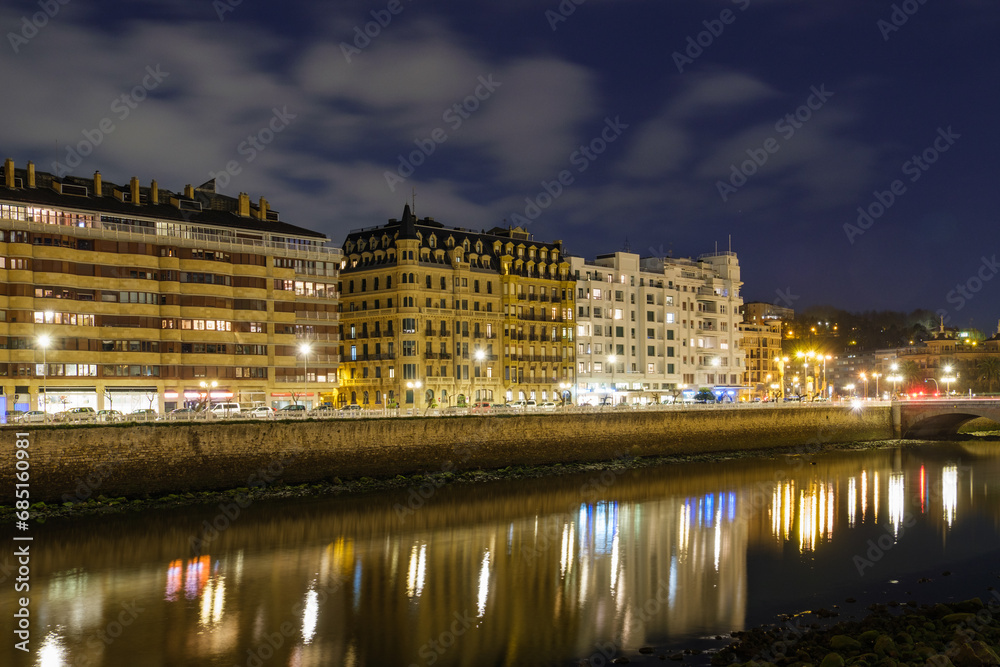 Night view of the old town by the coast in San Sebastián, Spain