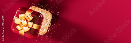 Open red gift box with glitter and golden bow on red background with copy space. 3D Rendering, 3D Illustration © hd3dsh