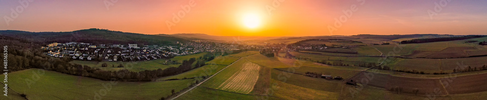 Panoramic aerial view of a sunset in winter over Taunusstein/Germany