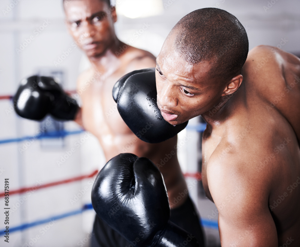 Boxing, black man and sparring partner with punch in ring together with fitness, power strike and training challenge. Strong body, hit and boxer in gloves, fearless and confident in competition fight