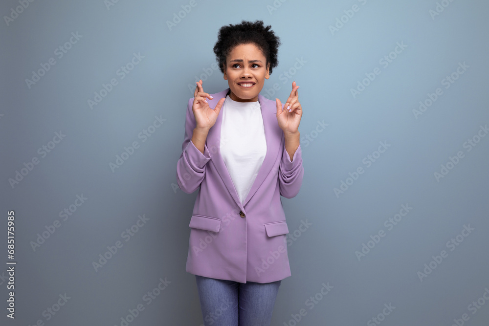 young hispanic business woman with ponytail dressed in a jacket is frightened young hispanic business woman with ponytail dressed in a jacket is frightened