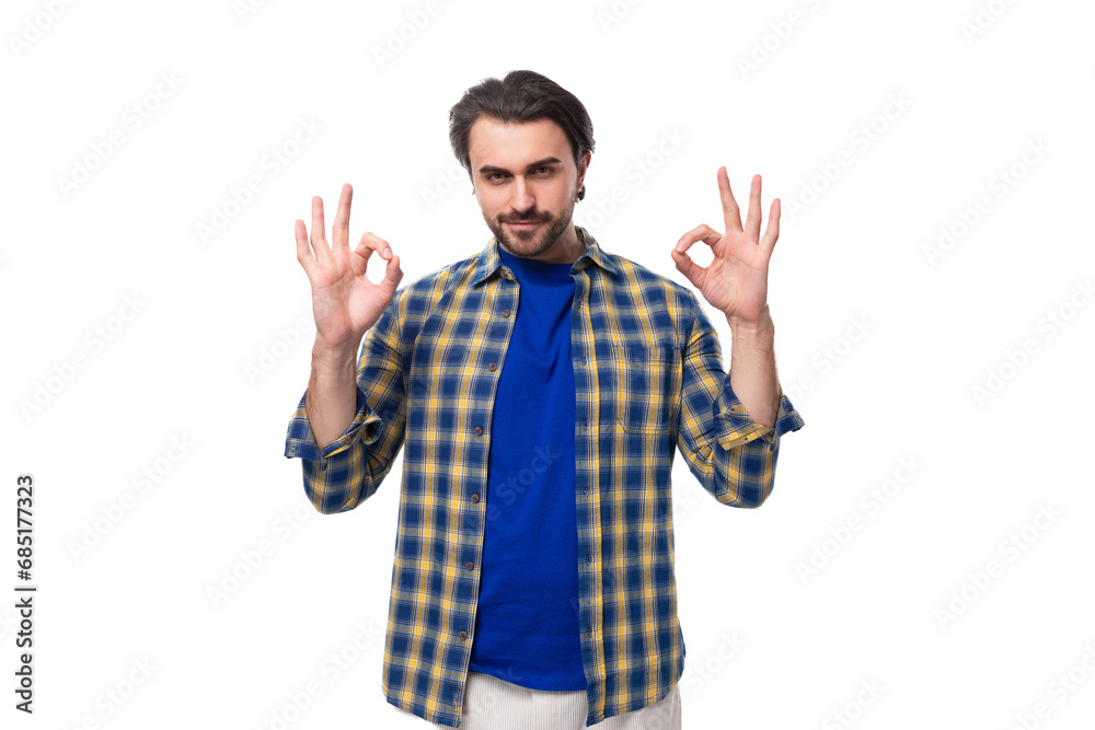 portrait of a young european brunette with a beard waving his arms wide portrait of a young european brunette with a beard waving his arms wide