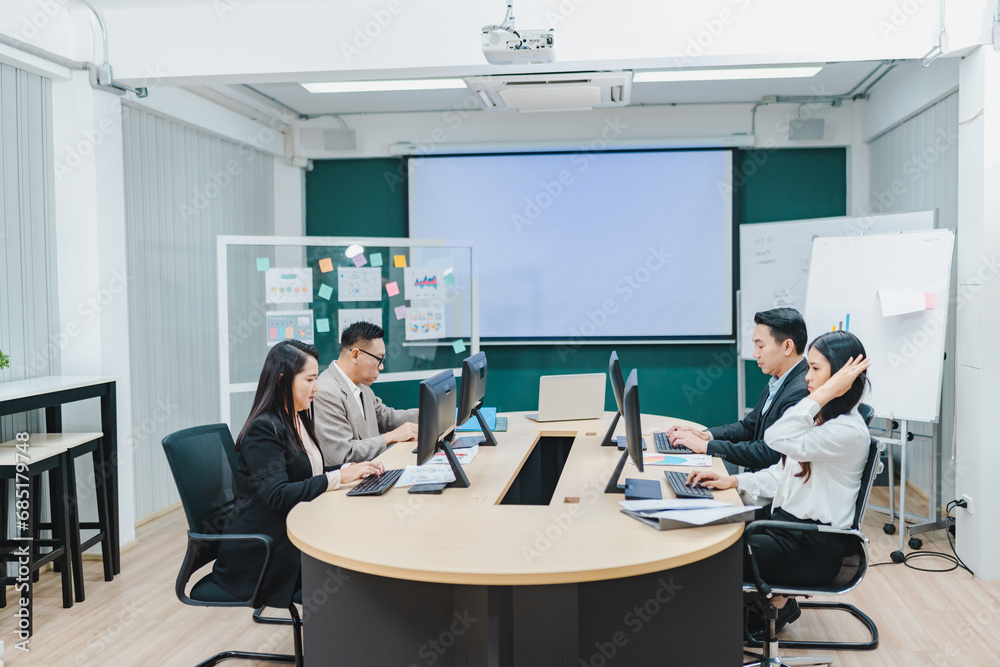 Group of multiethnic business people working and talking discussion in modern office, Businessman and businesswoman sitting around a conference table of business meeting seminar room Group of multiethnic business people working and talking discussion in modern office, Businessman and businesswoman sitting around a conference table of business meeting seminar room