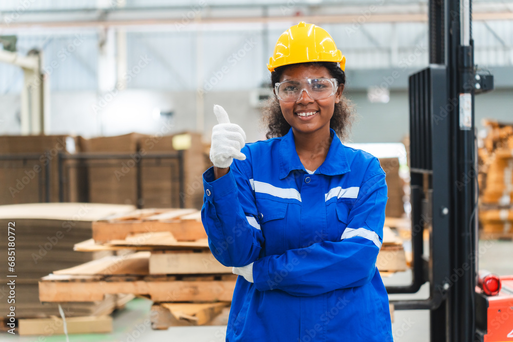 Portrait female professional engineer factory in protective uniform operating machine, Engineering worker in safety hardhat at warehouse industrial facilities, Heavy Industry Manufacturing Portrait female professional engineer factory in protective uniform operating machine, Engineering worker in safety hardhat at warehouse industrial facilities, Heavy Industry Manufacturing