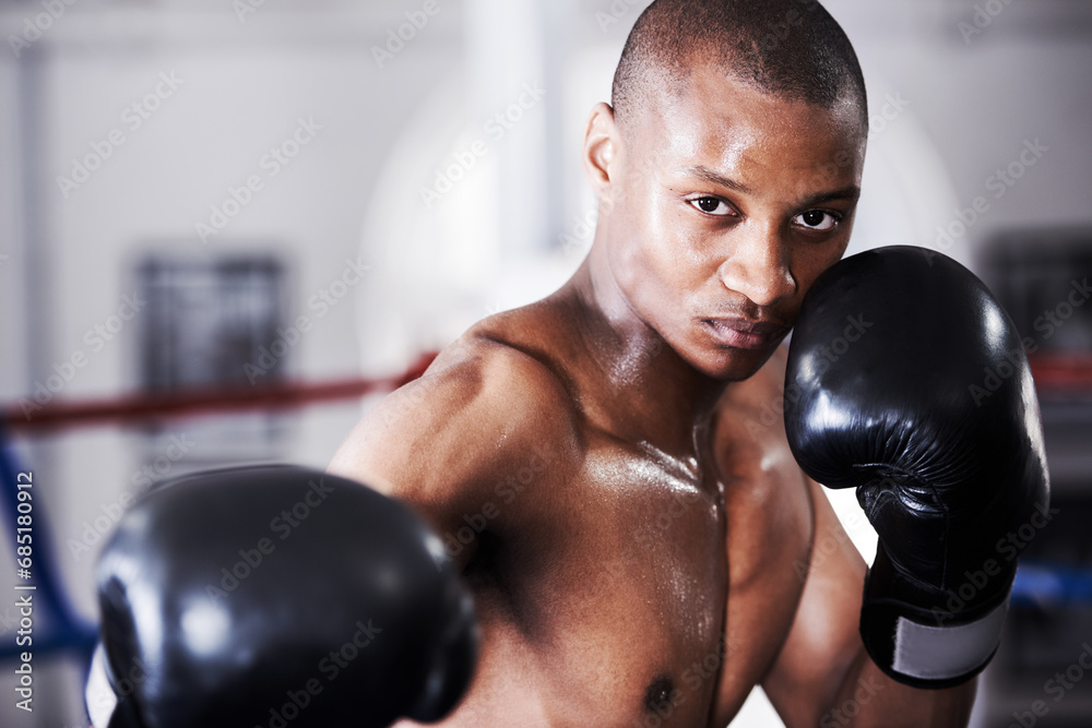 Boxing, gloves and punch, portrait of black man with fitness and power training challenge in gym. Strong body, muscle workout and boxer in club, fist of athlete with confidence, competition and fight