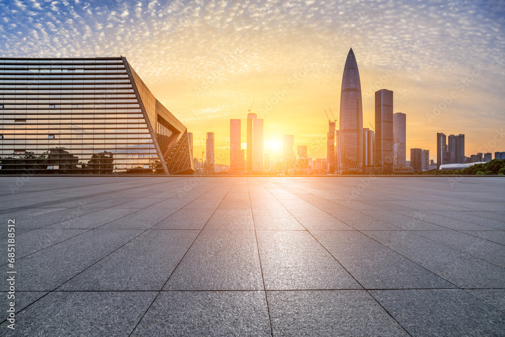 City square and skyline with modern buildings in Shenzhen at sunset, Guangdong Province, China.