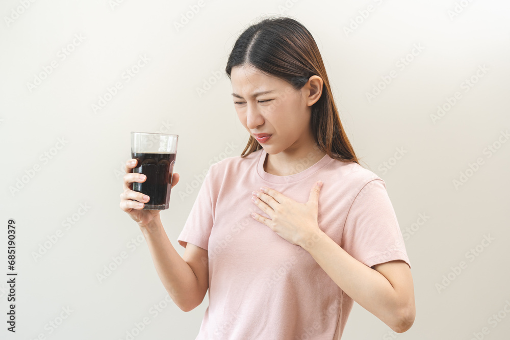 Acid reflux disease, suffer asian young woman, girl hand holding a