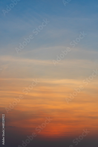 Orange and blue sunset sky gradient, copy space background. Red evening sky. © OHMAl2T
