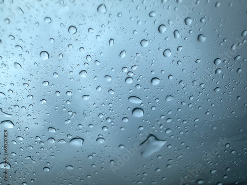 water droplets on glass,rainfall and creative concept