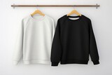black and white sweatshirt on hangers for product presentation,