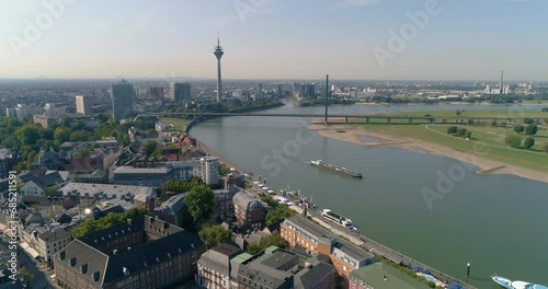 Dusseldorf aerial view of city in Germany, ship transport and skyline with bridge over river Rhine