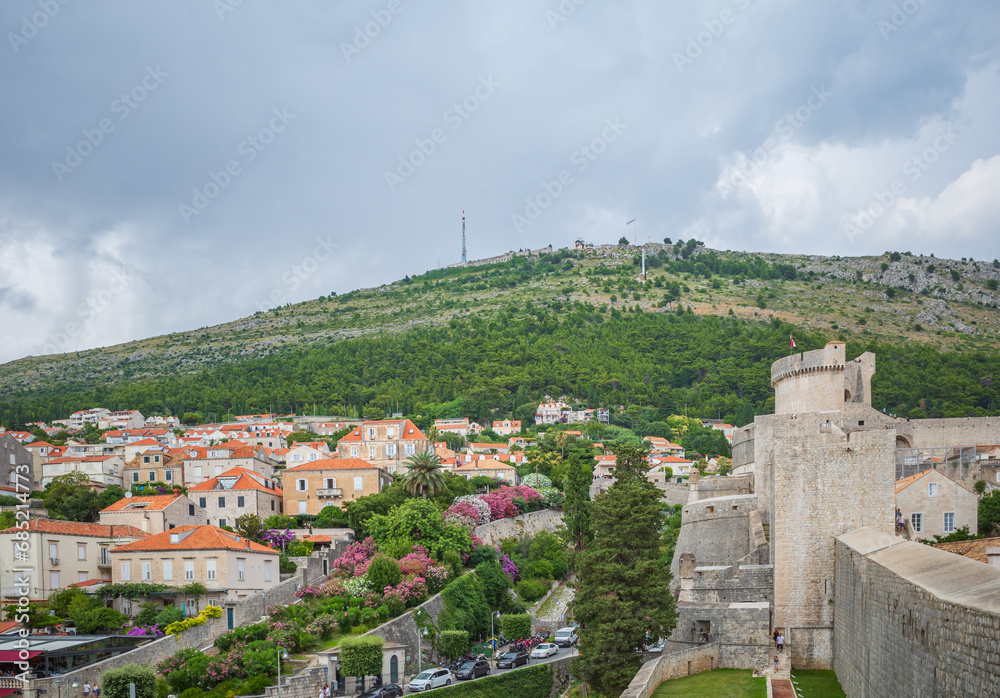 View to Dubrovnik city on green hills from walls of the Old Town