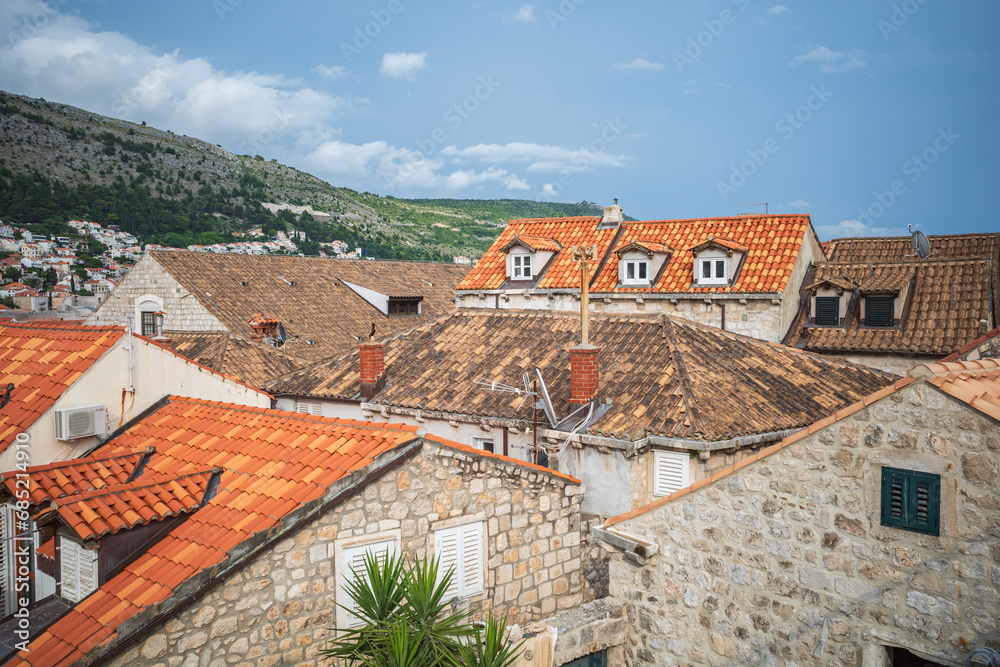 View to the red roofs of Dubrovnik Old town on cloudy summer day. View to the red roofs of Dubrovnik Old town on cloudy summer day.