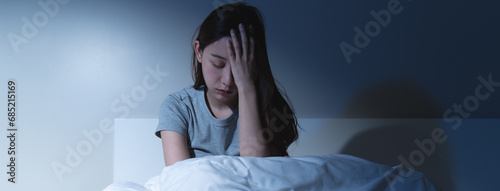 Anxiety disorder on insomnia woman concept, sleepless Woman open eye awakening on the bed at night time can't sleep from symptom of depression diseased. photo