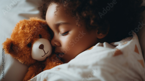 Child Sleeping Peacefully with Cuddly Teddy Bear in Cozy Bedroom Environment photo