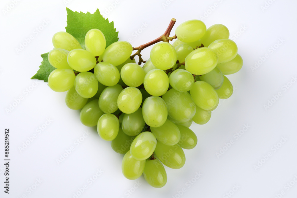 appetizing bunch of green grapes in the shape of a heart on a white isolated background,the concept of healthy nutrition,food styling,advertising banners for valentine's day