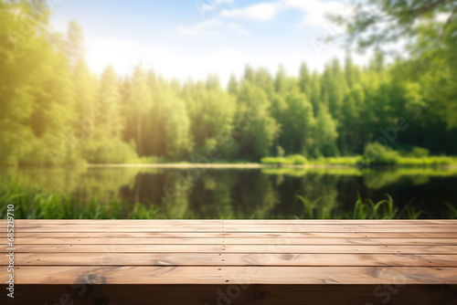 The empty wooden table top with blur background of summer lakes green forest