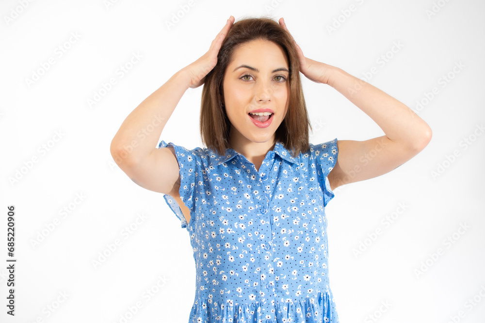 Close-up portrait of young pretty surprised woman with opened mouth standing with open palms, isolated over white background Close-up portrait of young pretty surprised woman with opened mouth standing with open palms, isolated over white background