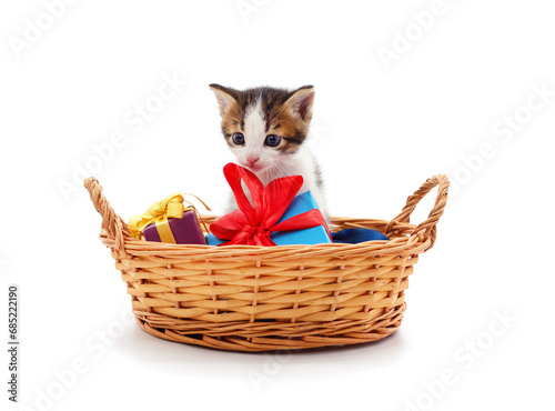 Kitten in a basket with gifts. © ANASTASIIA