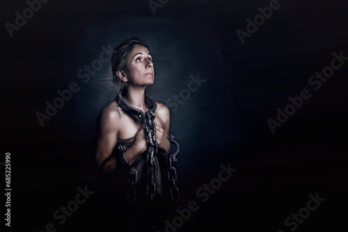Portrait of a Chained woman representing the oppression of women photo