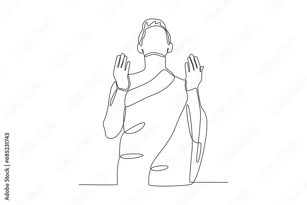 A man prays in Mecca. Hajj one-line drawing A man prays in Mecca. Hajj one-line drawing