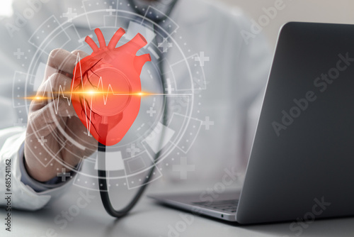 Cardiologist doctor touching heartbeat icon on virtual screen for checking the function of the patient heart. medical check up, heart attack, cardiology, help from specialist. photo