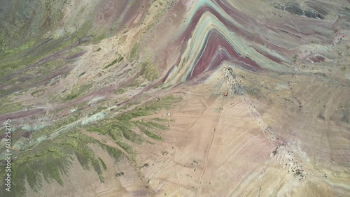 Drone view of Rainbow Mountain, officially Vinicunca, outsize Cuzco, Peru on a cloudy day