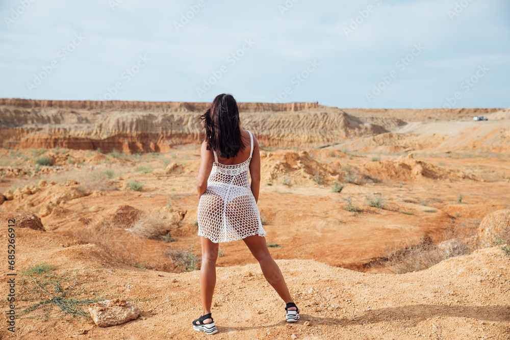 Woman looking into the distance on a walk journey Woman looking into the distance on a walk journey