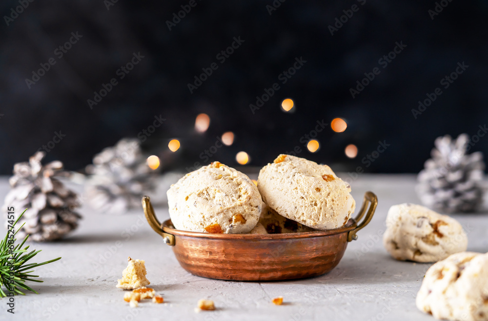 Italian traditional Christmas sweets Cavallucci in a rustic copper bowl over grey and black background with xmas decor Italian traditional Christmas sweets Cavallucci in a rustic copper bowl over grey and black background with xmas decor
