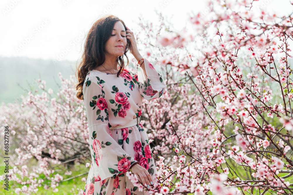 beautiful woman brunette in flowering trees spring nature travel walk beautiful woman brunette in flowering trees spring nature travel walk