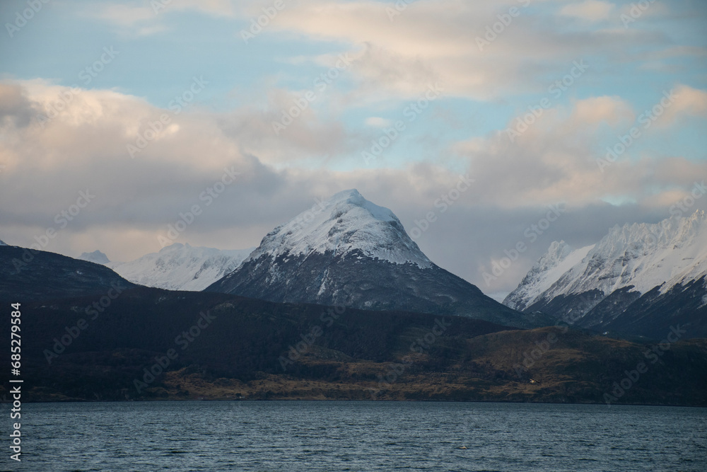 portrait of a snowy mountain in the golden hour, in the Beagle Channel, Ushuaia. patagonian winter