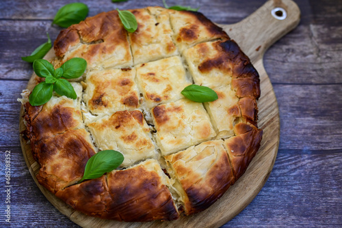 Bakery .Home made  cheese pie  with phyllo pastry and organic eggs. Bulgarian banitsa photo