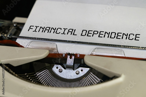 The text is printed on a typewriter - financial dependence photo