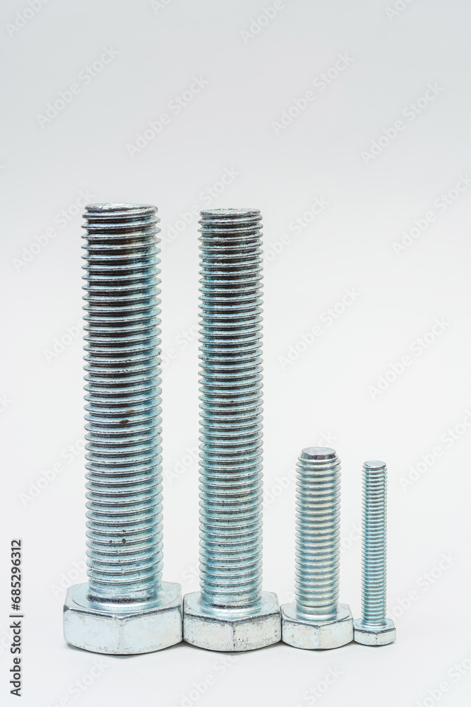 iron bolt on a white background. metal bolt on a light background. photos of a threaded bolt for the catalog iron bolt on a white background. metal bolt on a light background. photos of a threaded bolt for the catalog