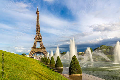 Eiffel Tower and fountains of Trocadero in Paris at sunset, France