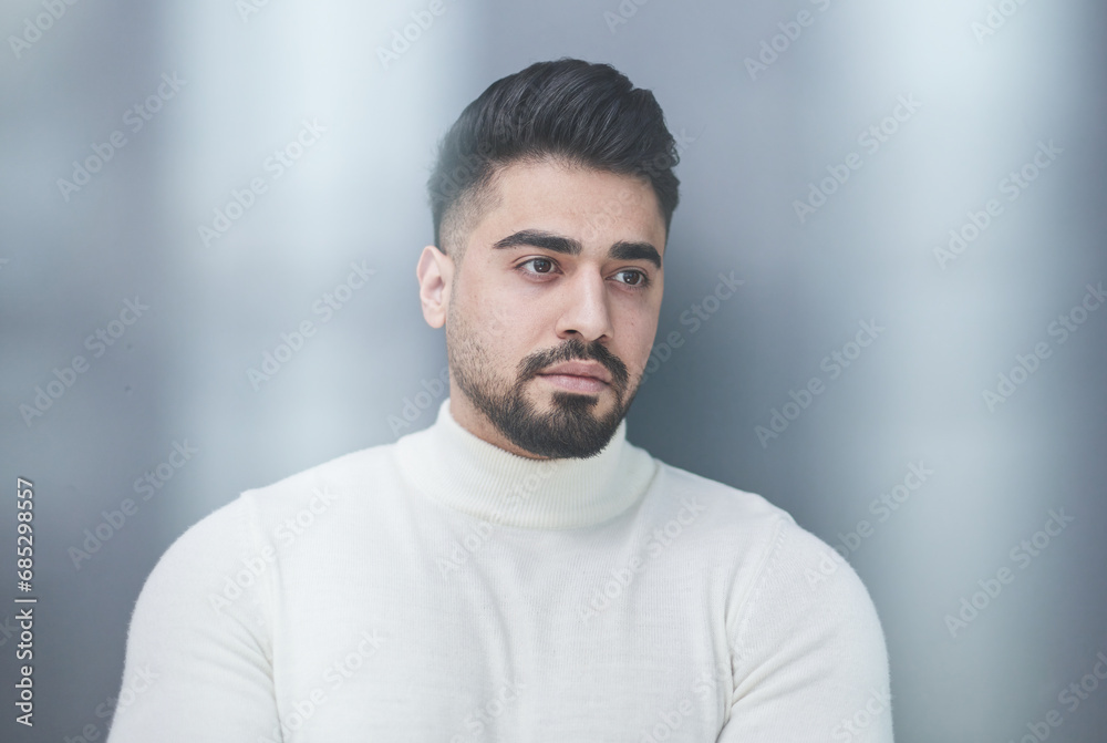 Portrait of stylish middle aged man posing on gray background