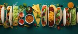 Mexican cuisine with a variety of dishes including tacos burritos nachos burgers and more Flat lay closeup copy space image
