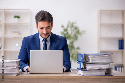 Young male employee working in the office